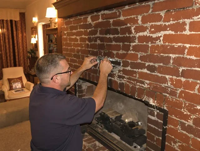 Diamond Bar Chimney Sweep expert fixing a fireplace in Diamond Bar, CA
